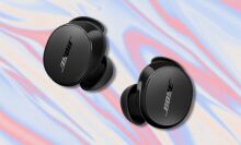 black bose quietcomfort earbuds on a red, tan, and light blue swirling background