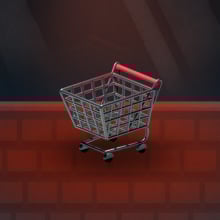 A miniature shopping cart sits on a keyboard.