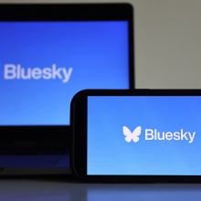 bluesky logo on a computer and phone