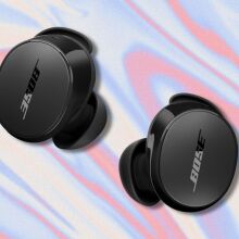 black bose quietcomfort earbuds on a red, tan, and light blue swirling background