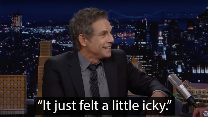 A man sits on a talk show couch, grinning. The caption at the bottom reads "It just felt a little icky."