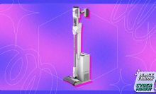 Shark cordless vacuum and auto-empty dock on purple and pink backdrop